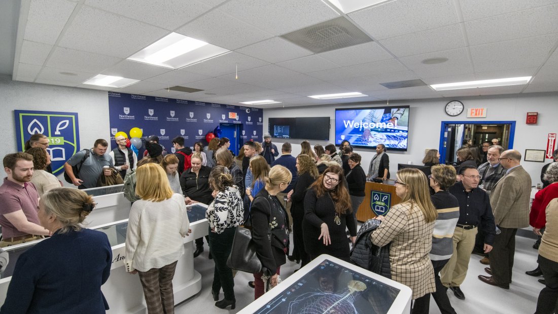 crowd of people mingling in the CARL